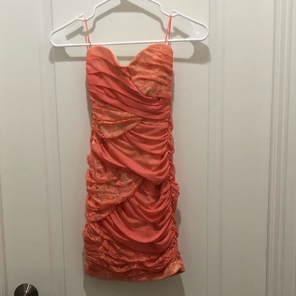 Worn once excellent condition mini lace sweetheart neckline, stretchy dress.